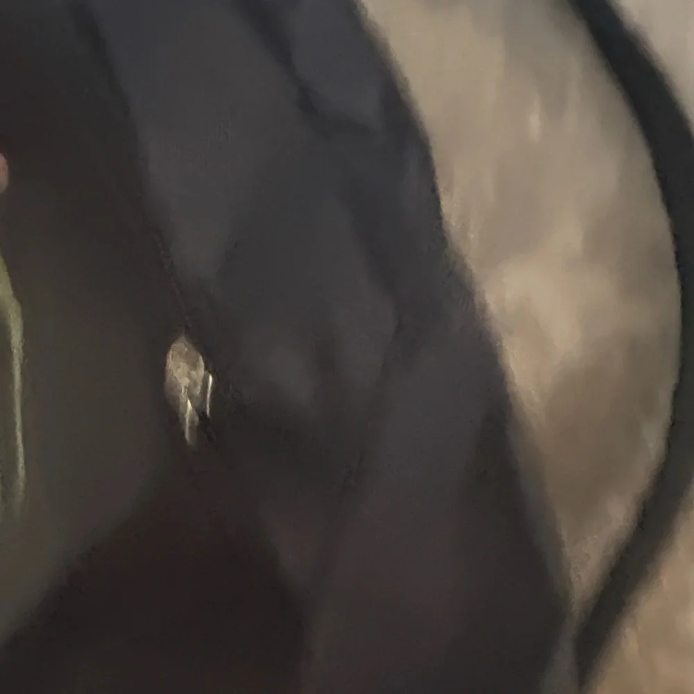 Black Backpack with Green Logo